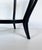 Elegant round coffee table from the 1950s, attributable to Paolo Buffa (1903-1970), made entirely of ebonized beech with...