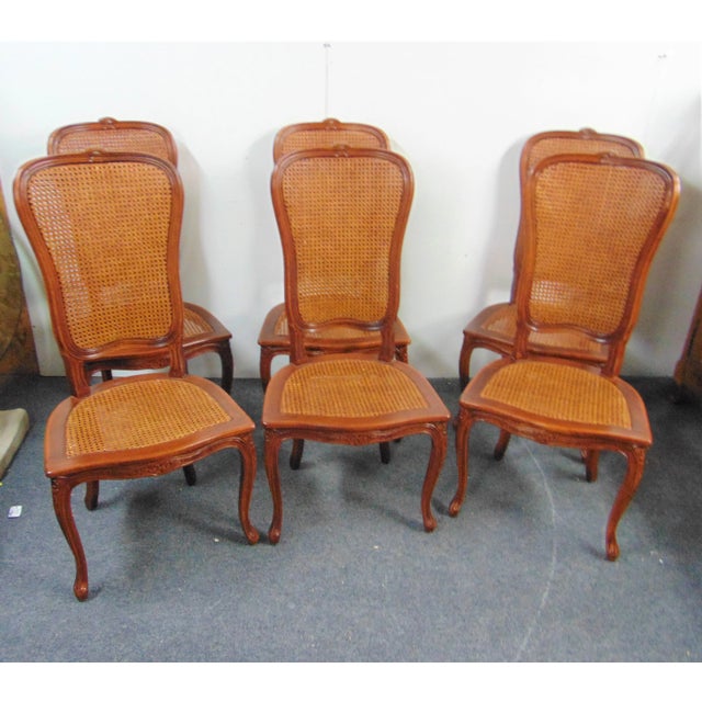 Set of 6 Louis XV style dining chairs , Solid cherry frames with floral carved accents, caned seat and double caned backs