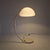 Martinelli Luce's Serpente Floor Lamp, designed by Elio Martinelli in 1965, represents a milestone in modernist design....
