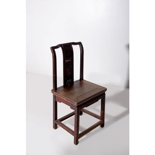 This Chinese chair, dating from the late 1800s and crafted in the Ming style, is a fascinating example of traditional...