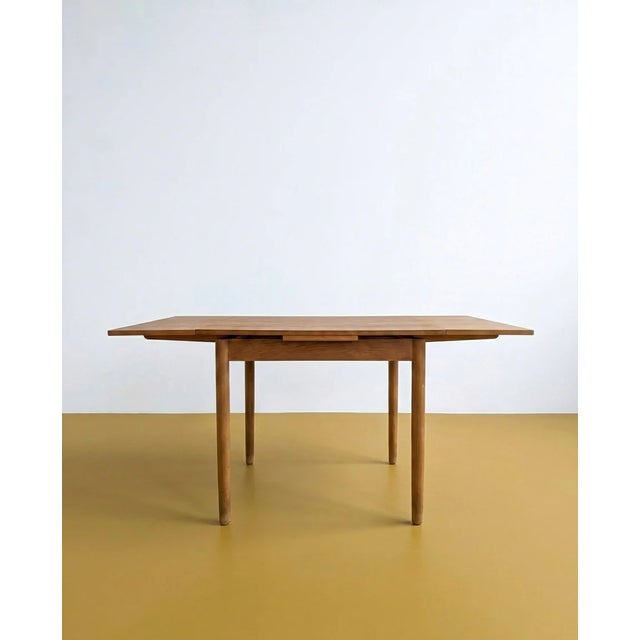 Photo before restoration. Vintage 1960s Danish square oak table with two side extensions, a versatile design perfect for...