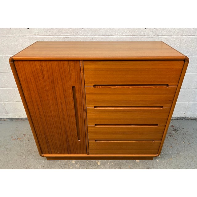 Exceptional vintage Mid-Century Modern teak gentleman’s chest by The Sun Cabinet Co. Ltd., showcasing the rich warmth and...