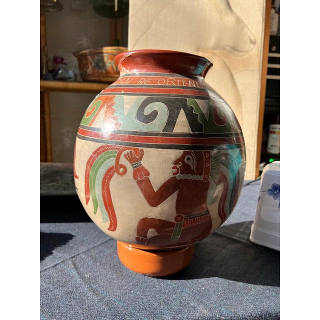 Up for consideration is a beautiful large spherical hand painted detailed vase with a stand. This piece would look lovely...