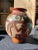 Up for consideration is a beautiful large spherical hand painted detailed vase with a stand. This piece would look lovely...