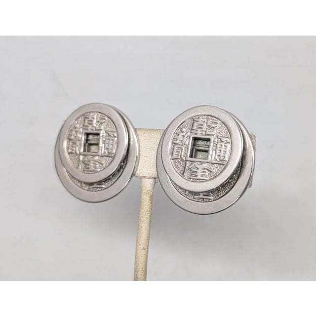 Mid-Century Modern Vintage Signed Napier Doris Day Rhodium Plated Two Stacked Asian Coins Clip Earrings-2 Pieces For Sale - Image 3 of 9
