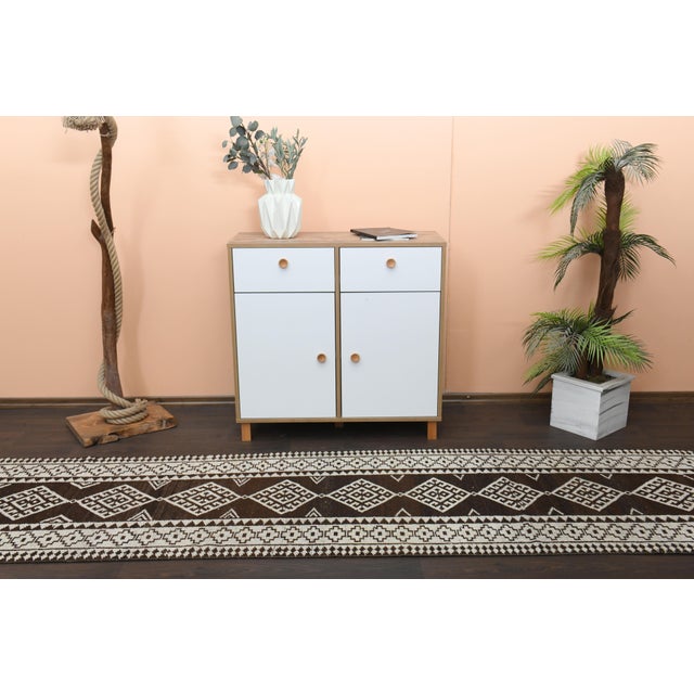 Vintage Turkish Hand-Knotted vintage rug is a semi-antique vintage runner rug. The '70s Eastern region of Turkey's unique...