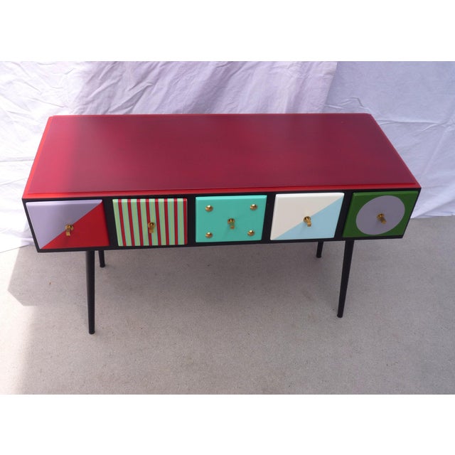 Mini chest of drawers created from common file cabinets from the pre-computer era\. Lacquered finish with brass inclusions...