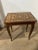 small four legged table . signed made in italy. wonderful marquetry work on this delightful music box table . probably...
