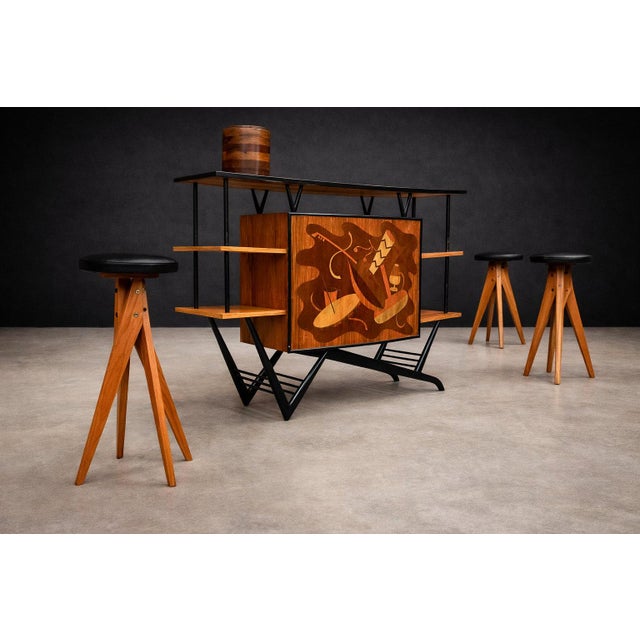 A museum-worthy Brazilian bar cabinet executed in three noble woods—Imbuia, Roxinho, and Pau Marfim—celebrating the...