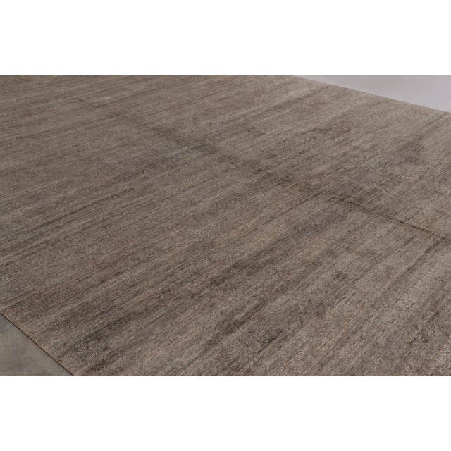 Hand-knotted in a luxurious blend of wool and silk, this monumental 14x15 rug is a rich new addition to Rug & Kilim’s...