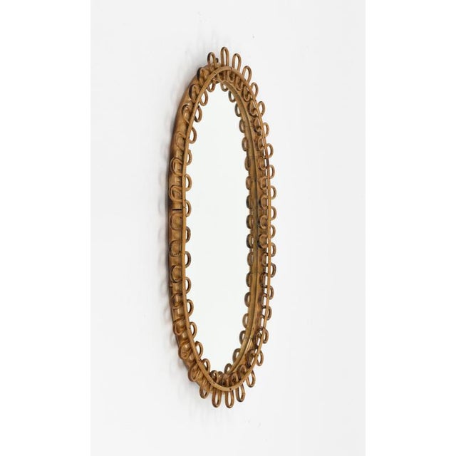 Midcentury beautiful oval wall mirror in bamboo and rattan in the style of Franco Albini. Made in Italy in the 1960s. A...