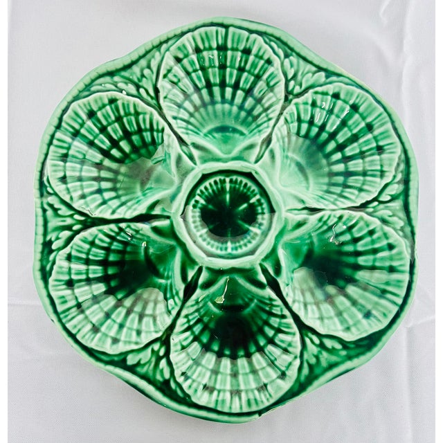 Sourced in Nice, France. Circa 1920s Sarreguemines majolica green tone oyster plate. Makers mark on the reverse side....