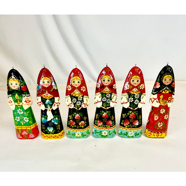 Vintage Home is pleased to offer this set of Russian Christmas Ornaments. They are both hand-carved wood and enamel...