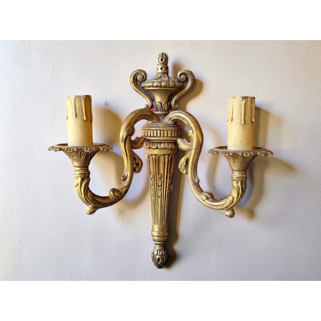Pair of gilt bronze wall sconces in the Transition/Louis XVI style, 19th century Height 30 cm Width 27 cm Depth 11.5 cm...
