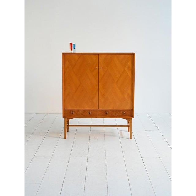 Elm cabinet with burl veneer and brass details. Made by ab seffle möbelfabrik, sweden, 1950s. made in sweden in the...