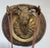 Antique heavy hand-hammered bronze and wood dinner gong. The gong is made of solid bronze, and hangs from a bronze deer...