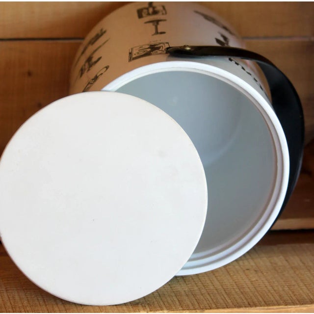 This is a vintage vinyl or patent leather extra tall ice bucket with lid called The Telephone Story. The oldest picture of...