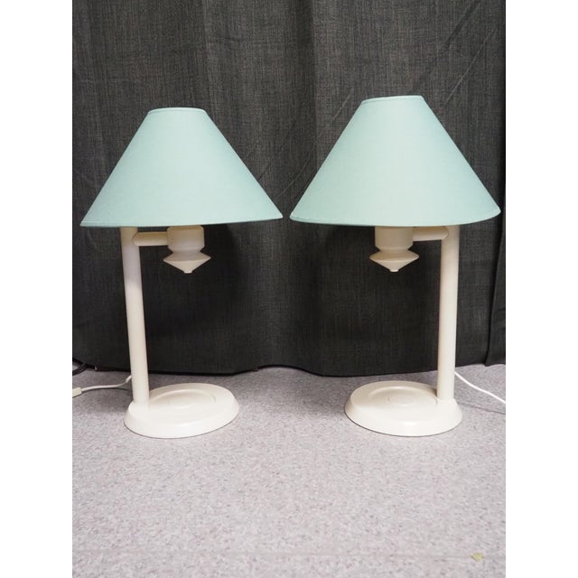 A pair of white painted pine wood table lamps from the famous swedish company ikea. a stylish model in its simplicity, and...