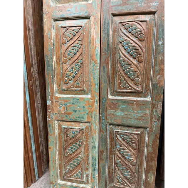 Bring timeless character into your home with these vintage hand-carved wood double doors, finished in a beautifully...