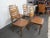 Pairing sculpted teak frames with upholstered vinyl seats, this set of four Danish dining chairs is a great way to add...