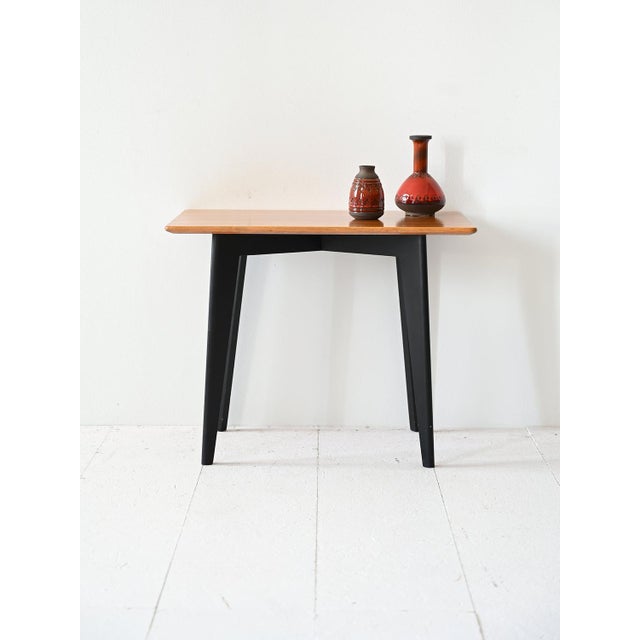 A vintage coffee table from the 1960s, signed by the swedish company nk, characterized by a rectangular top with rounded...