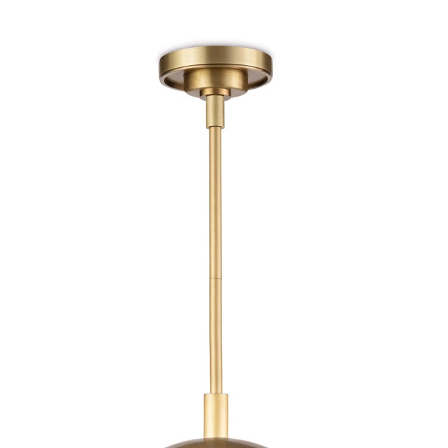 The clear glass shade of the Cafe Pendant acts as a barely-there surround on the metal rod, column and arms. The metal cap...