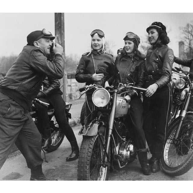 The Motor Maids In Bellerose, Queens A male motorcyclist, Lou, taking a photograph of female bikers, Marian Willgoes, Joan...