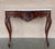 20th century French Regence style beautifully carved with leaves walnut console. White marble top with carved front, over...
