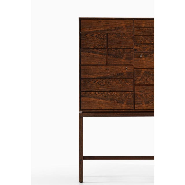 This freestanding cabinet, attributed to Børge Mogensen and produced by Fredericia Møbelfabrik in Denmark during the...