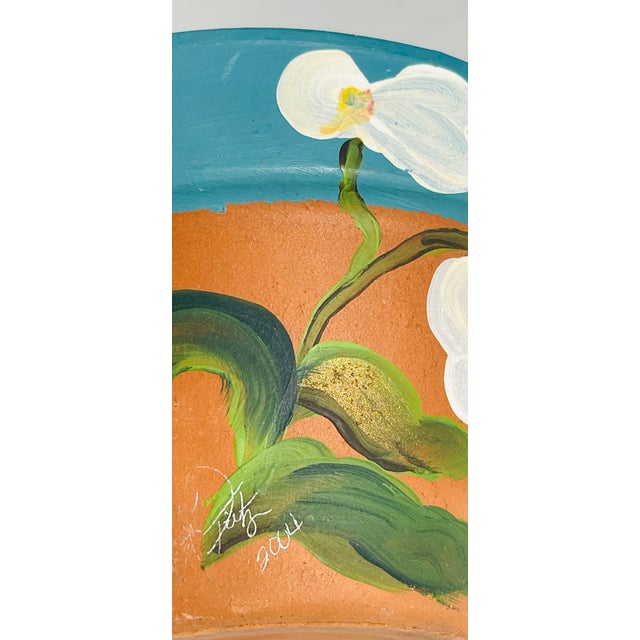 Lovely Handpainted vintage terracotta flower pot painted with orchids and signed.