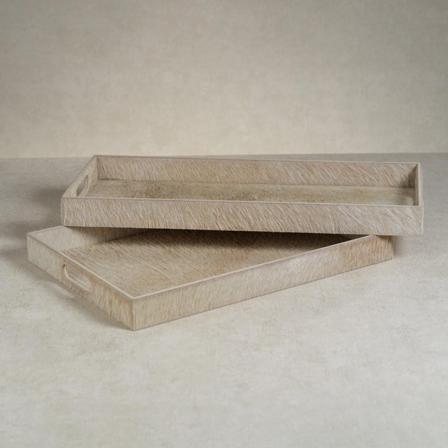 The Hair-On-Hide Leather Serving Tray offers both style and practicality with its chic rectangular design. Featuring...