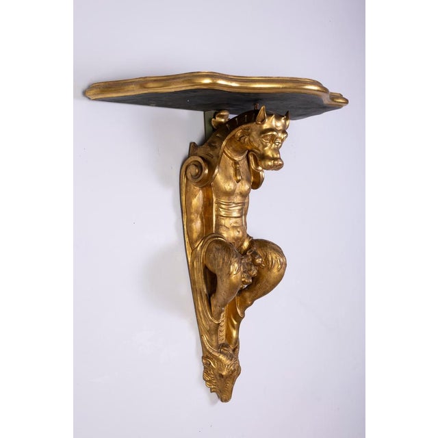 Pair of Tuscan Giltwood Wall Consoles with Grotteschi Tuscany, Italy, late 17th – early 18th century An exceptional and...