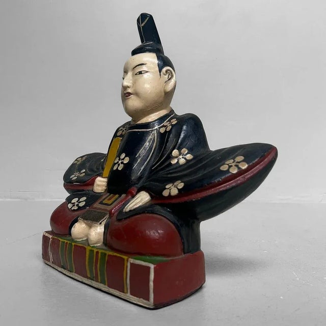 A remarkable Japanese plaster figure, entirely hand-painted and finished with a glossy lacquer coating. It represents...