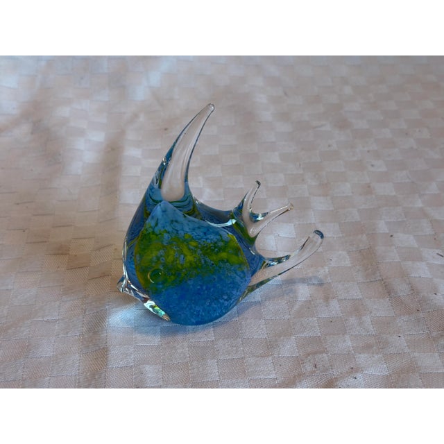 Five, mid 20th C Murano glass fish. Each fish is unique in color and shape. They each have a flat base so that they can be...