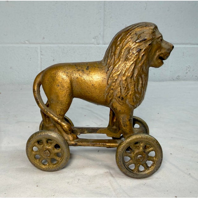 Up for sale is an exquisite antique AC Williams hand-painted cast iron lion on wheels still bank made in the 1920's. This...