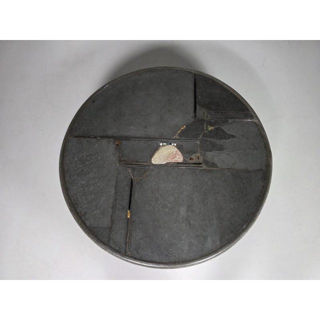 Round coffee table by Dutch artist Paul Kingma, signed and dated 1994. The circular tabletop features Kingma’s...