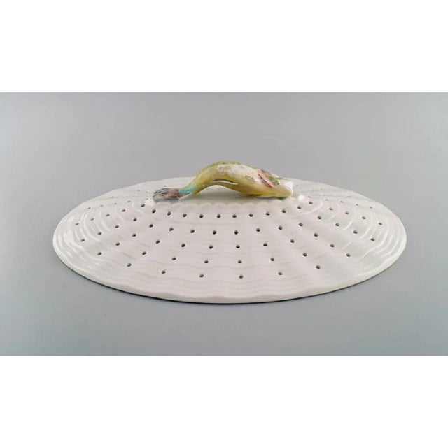 Large Royal Copenhagen Fauna Danica/ Flora Danica porcelain fish strainer modelled with hand-painted fish. Dated 1951....
