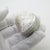 This vintage silver decorative object is shaped as a heart (Cuore) and features a raised floral relief on the lid....