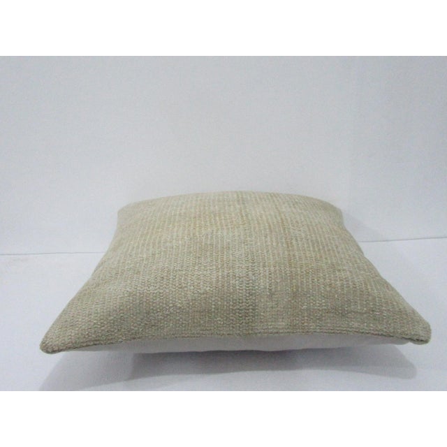 Decorative pillow cover made from a vintage Turkish handknotted rug. Backed with good quality cotton fabric. Pillow...