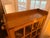 Stickley model 89-643 features a glazed door and geometric muntin’s, overhanging top featuring exposed through-tenon...