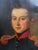An early 19th century oil on canvas of an officer in a dark blue uniform with red collar and epaulets, probably British or...