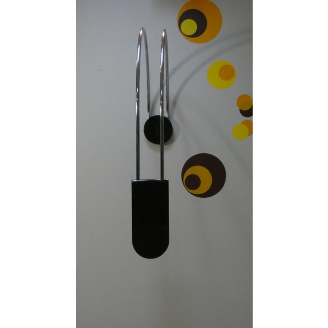 Large lamp featuring a minimalist design inspired by the Bauhaus aesthetic. It uses materials such as chromed steel and...