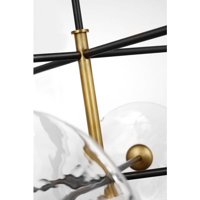 Calvino X-Large Radial Chandelier in Aged Iron and Hand-Rubbed Antique Brass with Clear Glass Designer: Ian K. Fowler...