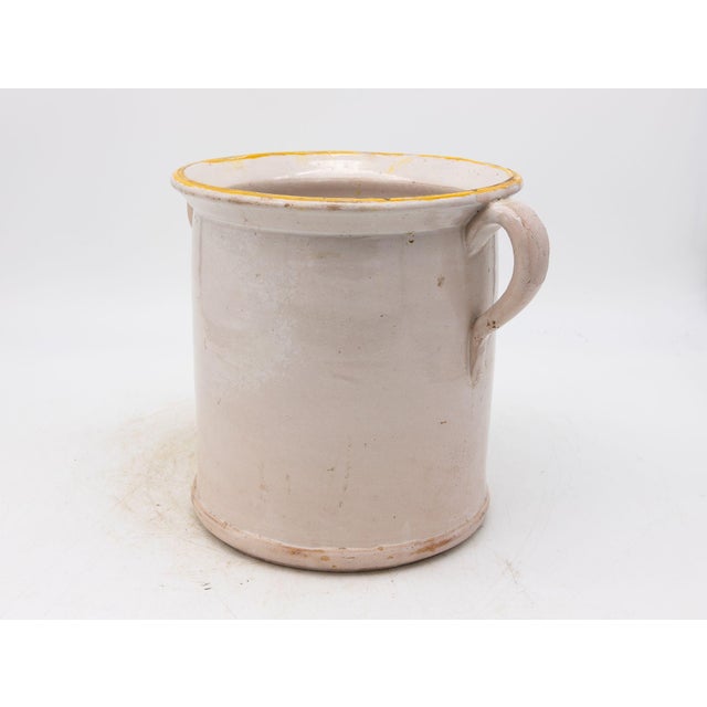 This 19th-century French confit pot features a classic glazed stoneware body with traditional dual handles, both...