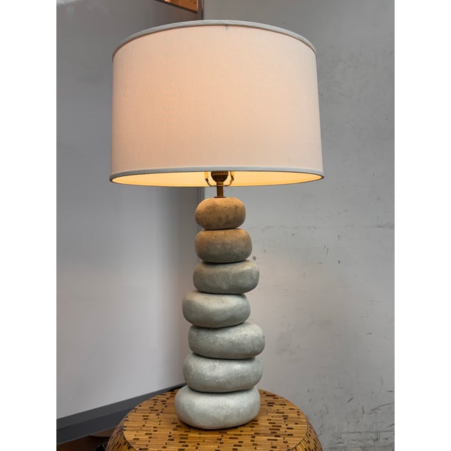 Design Plus Gallery presents a Faux Stone Table Lamp. A faux composite stacking rock formation rises in graduated rounded...