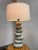 Design Plus Gallery presents a Faux Stone Table Lamp. A faux composite stacking rock formation rises in graduated rounded...