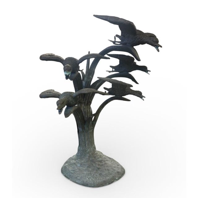 Elevate your outdoor sanctuary or sunroom with this captivating vintage bronze fountain depicting a flock of five birds...