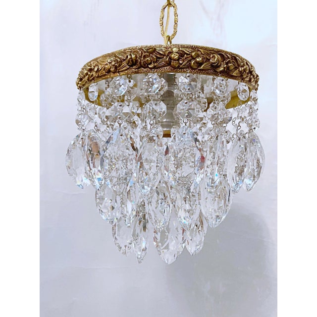 Italian upside down layered chandelier with bronze rim and 30% leaded almond cut crystal drops. Restored, rewired and it...