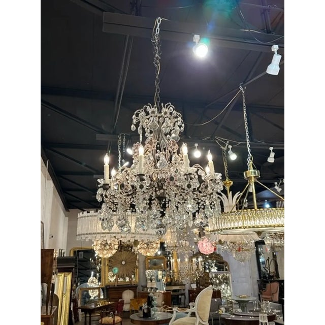Vintage Italian beaded crystal and amethyst flower 8-light chandelier. Circa 1940. The chandelier has been professionally...