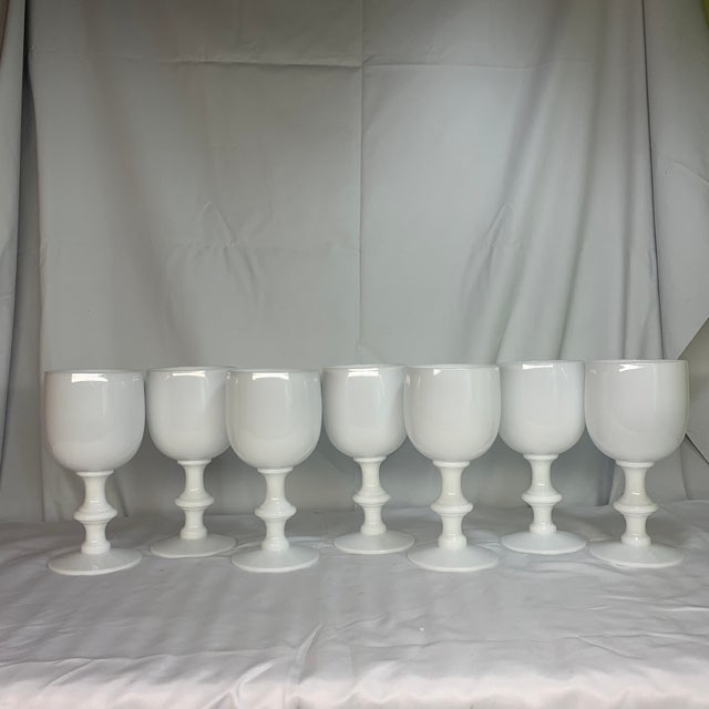 Elevate your tablescape with this stunning, highly collectible set of 7 vintage white opaline wine and water goblets...